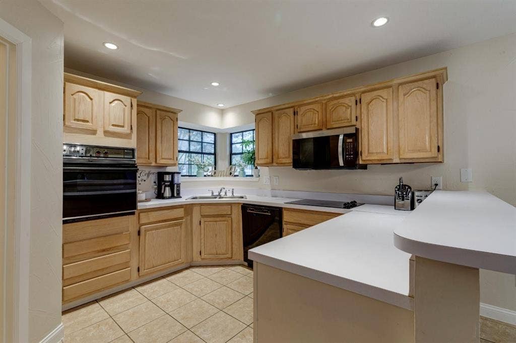 1408 Quapaw Trail, Mesquite, TX 75149 Kitchen featuring light wood cabinetry, recessed lighting, double wall oven, and a built-in microwave