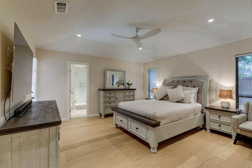 1408 Quapaw Trail, Mesquite, TX 75149 Light wood-finish flooring, recessed ceiling lighting, ceiling fan, and multiple windows with blinds