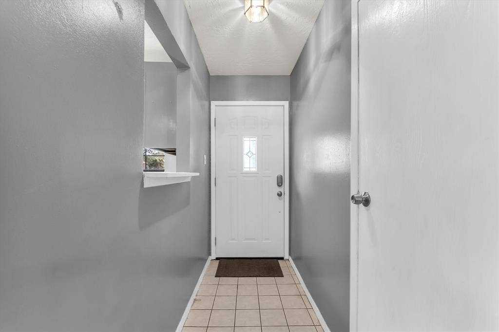 261 Oakview Circle, Waco, TX 76705 Entryway featuring a white door with decorative glass inserts, recessed lighting, and tile flooring
