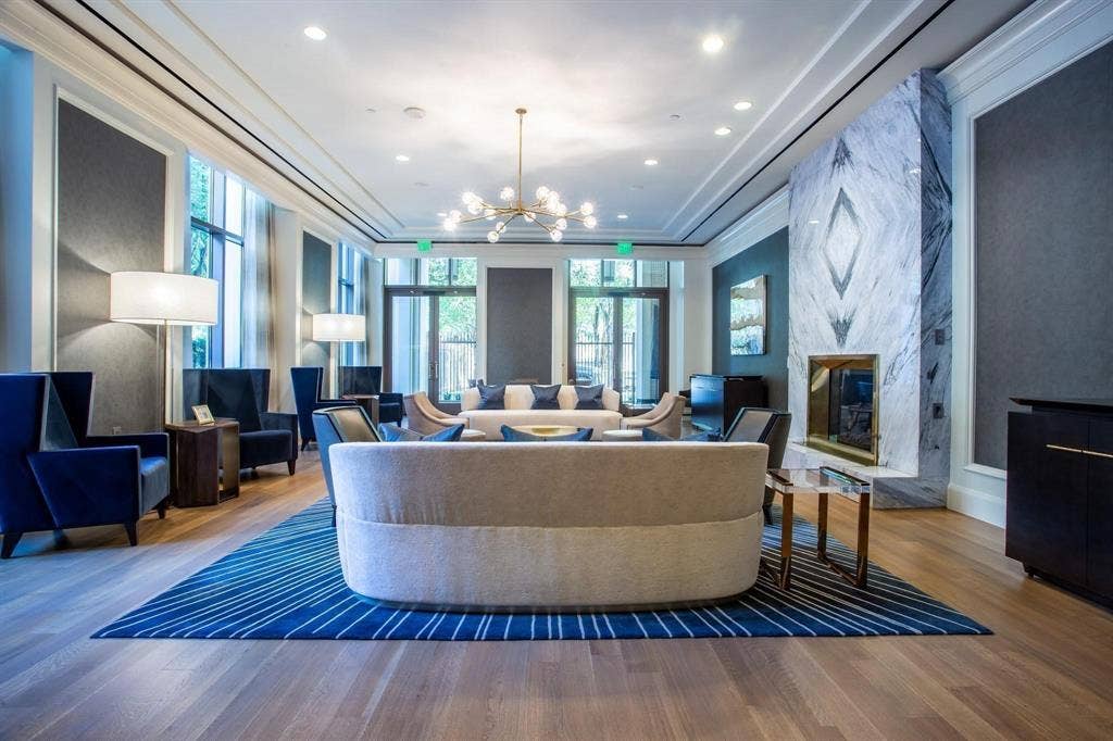 2525 N Pearl Street, #1001, Dallas, TX 75201 Large Owner's Lounge with book-matched marble FP, perfect for gatherings or happy hours.