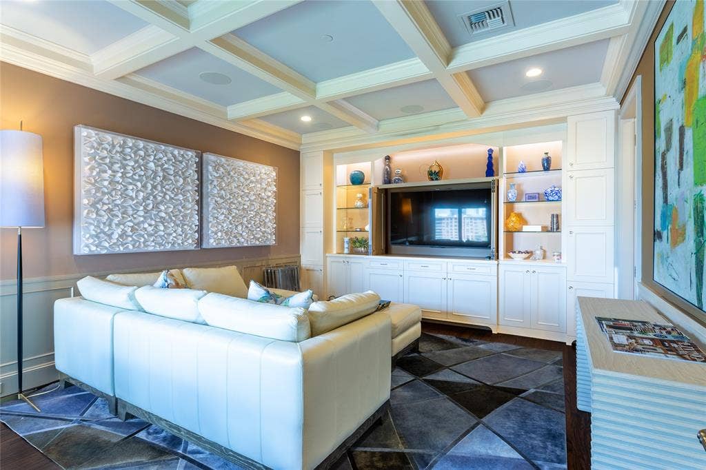 2525 N Pearl Street, #1001, Dallas, TX 75201 Wall of built-ins with doors to hide the TV