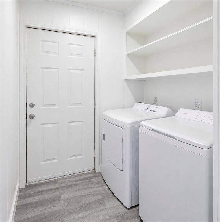 6048 Hidden Circle, Azle, TX 76020 Laundry area featuring built-in shelving and wood-finish flooring