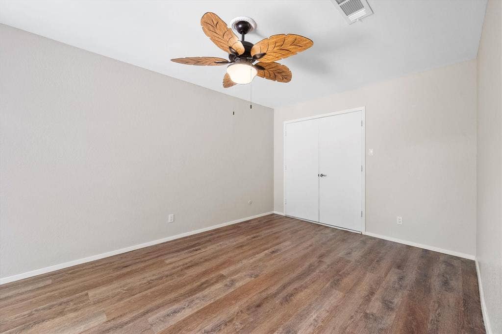 2216 Winter Sunday Way, Arlington, TX 76012 Secondary bedroom (1) - large with a cedar closet and floor safe and access to front courtyard