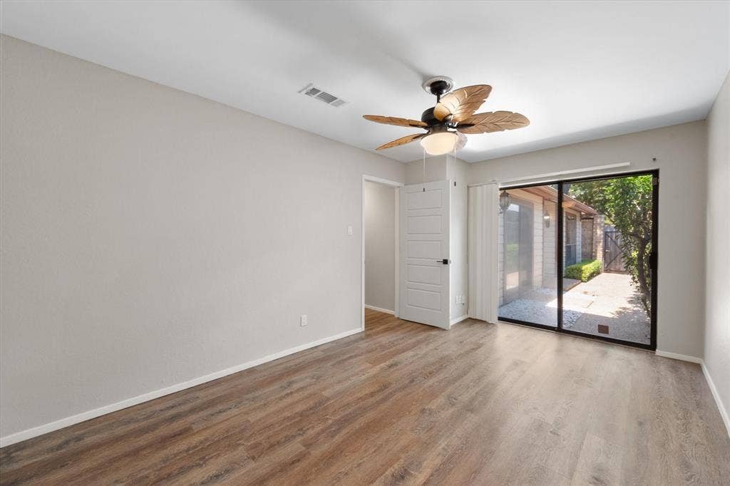 2216 Winter Sunday Way, Arlington, TX 76012 Secondary bedroom (1) - large with a cedar closet and floor safe and access to front courtyard