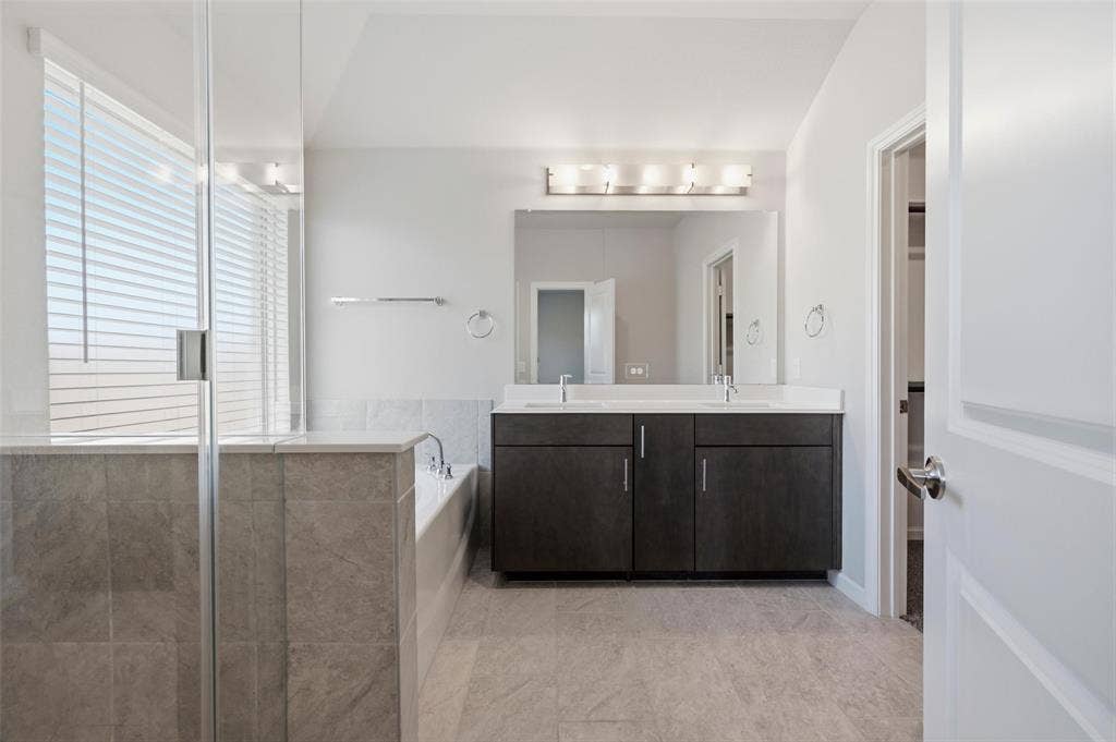 4425 Ridgehurst Lane, Fort Worth, TX 76036 Dual vanity with undermount sinks, full-width mirror, and multi-light fixture