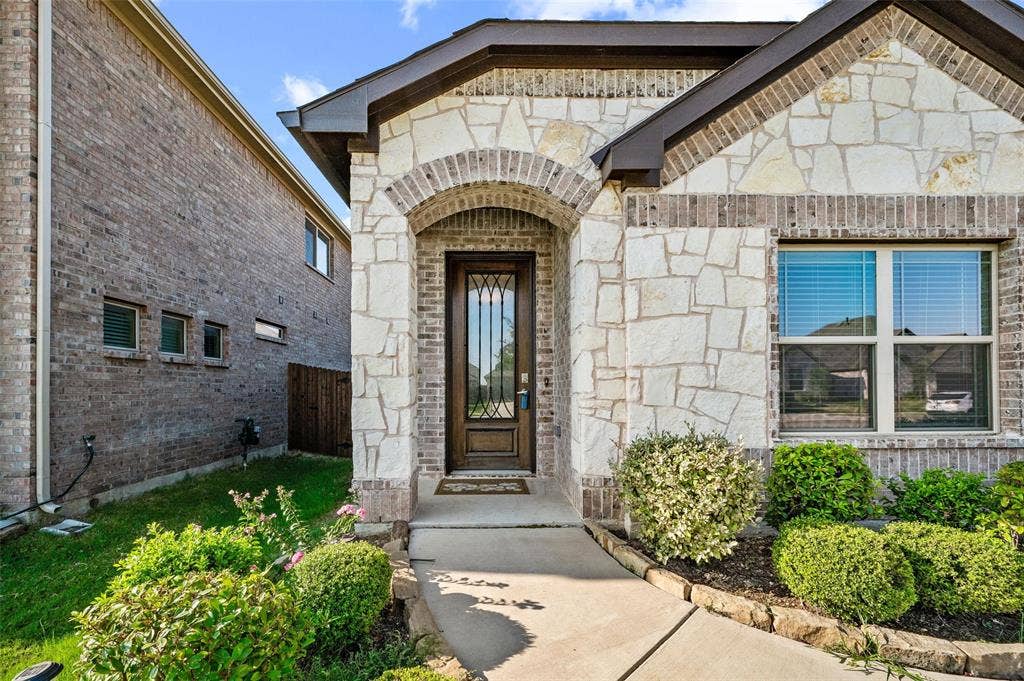 4425 Ridgehurst Lane, Fort Worth, TX 76036 Stone and brick facade with an arched entryway