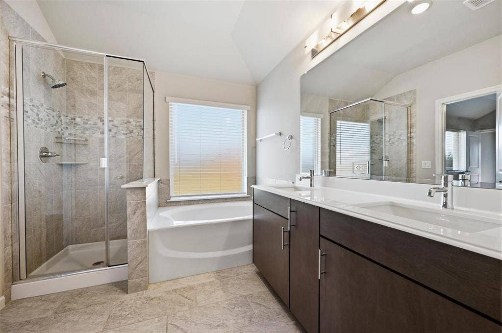 4425 Ridgehurst Lane, Fort Worth, TX 76036 Dual vanity with white countertops, undermount sinks, and chrome faucets