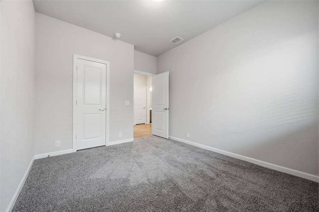 4425 Ridgehurst Lane, Fort Worth, TX 76036 Neutral wall finishes, recessed ceiling light, and grey carpeting