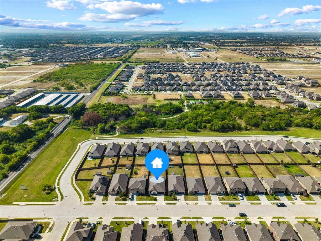 4425 Ridgehurst Lane, Fort Worth, TX 76036 Aerial perspective showcasing a residential community with uniform lot sizes and a street grid layout