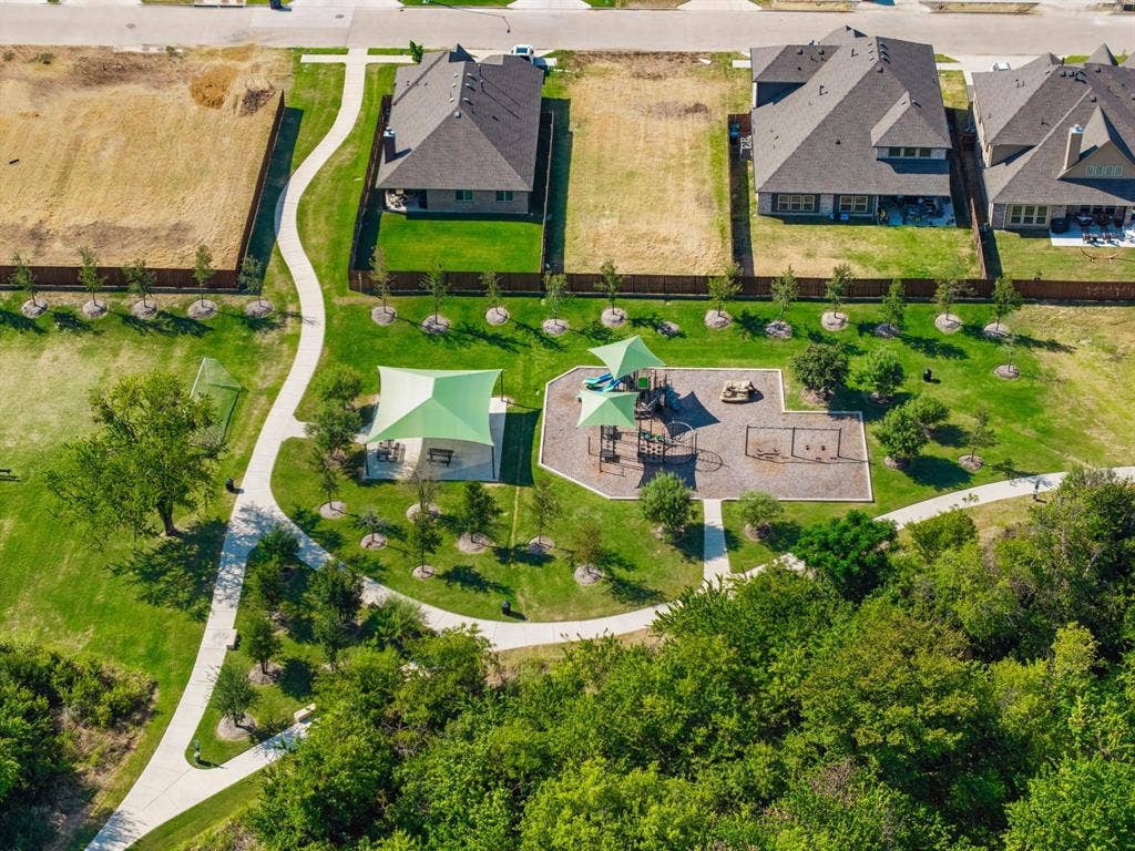 4425 Ridgehurst Lane, Fort Worth, TX 76036 Expansive green spaces featuring a playground, shaded picnic area, and paved pathways