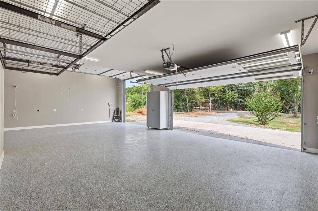 211 Shahan Drive, Shady Shores, TX 76208 Front garage doors open