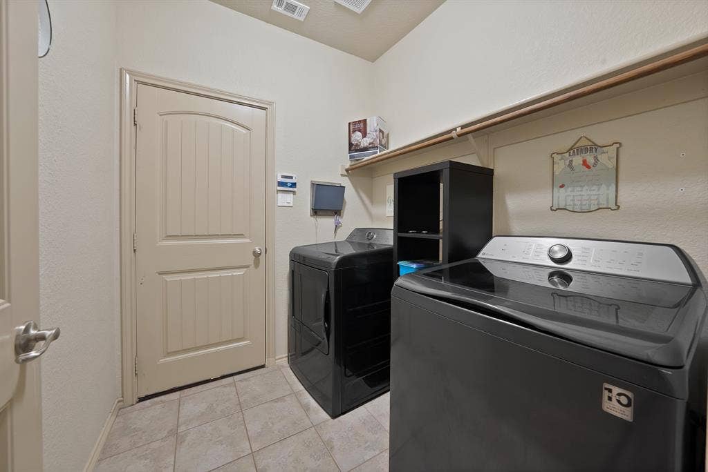 Tiled flooring, built-in shelving, and a sturdy hanging rod