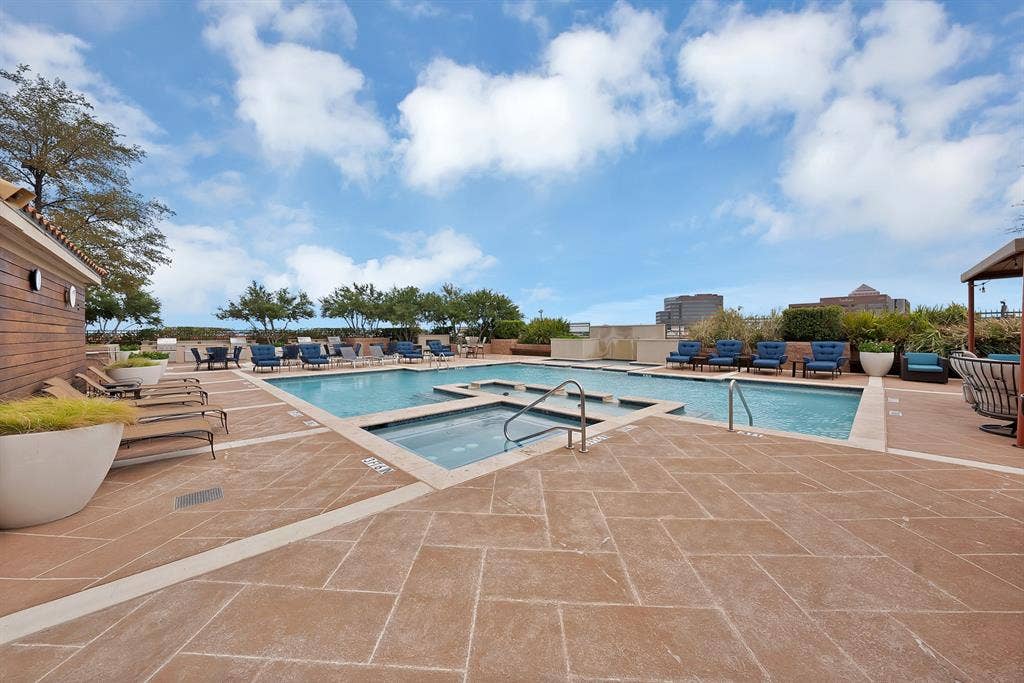 330 Las Colinas Boulevard E, #338, Irving, TX 75039 Expansive outdoor pool area featuring a rectangular pool, integrated spa, and spacious paver deck