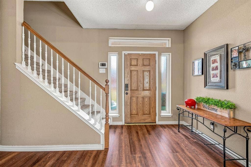6913 Chaco Trail, Fort Worth, TX 76137 Wood-finish flooring throughout the entryway
