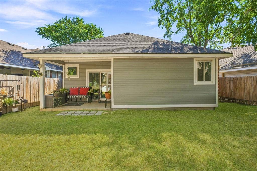 6913 Chaco Trail, Fort Worth, TX 76137 Private rear yard with a covered patio, sliding glass doors, and a partial privacy fence