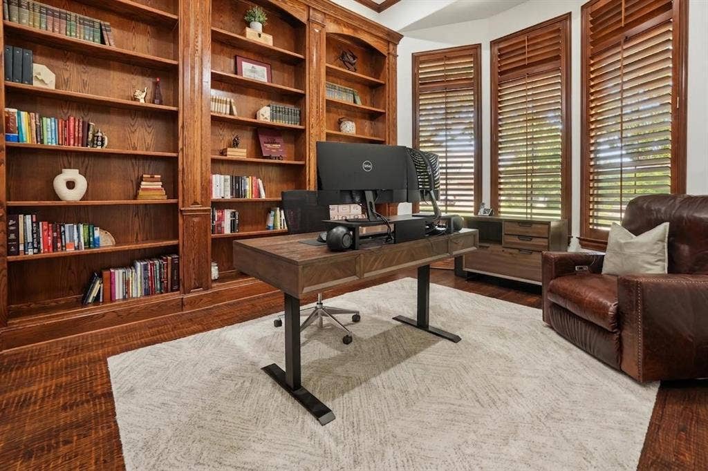 1712 Singletree Court, McKinney, TX 75072 Custom cabinetry and hardwood floors give the dedicated study a polished, established feel.