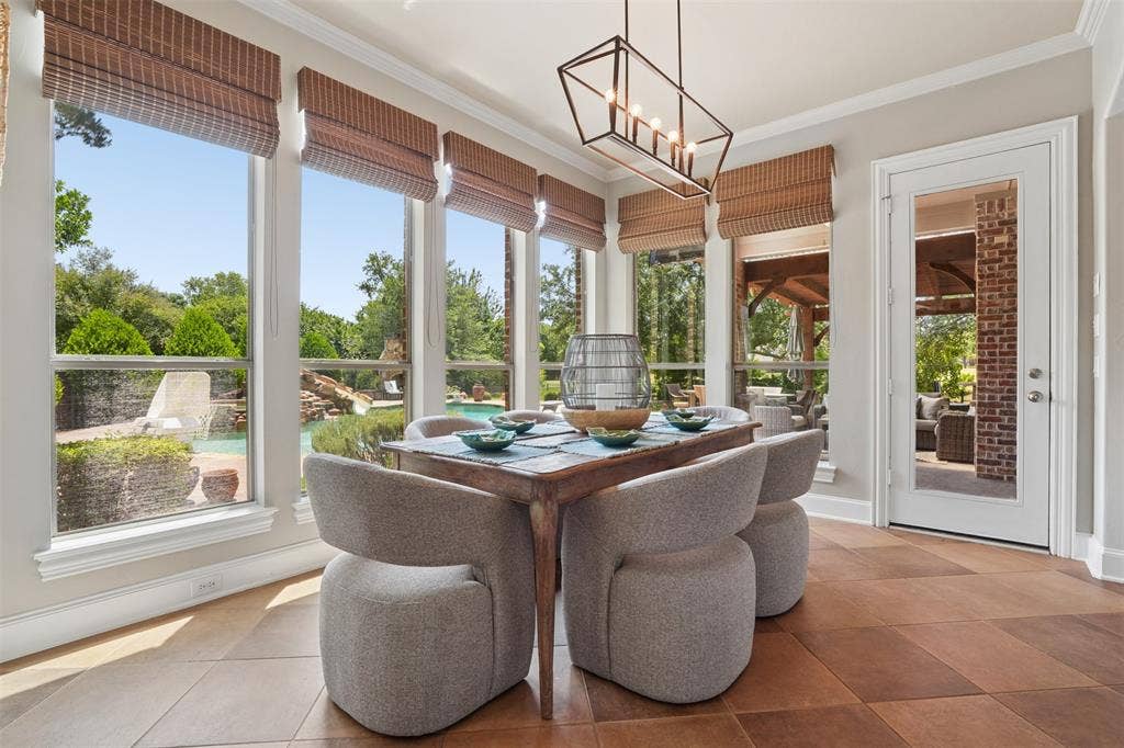 1712 Singletree Court, McKinney, TX 75072 ight-filled breakfast area provides a beautiful everyday dining space beside the kitchen.