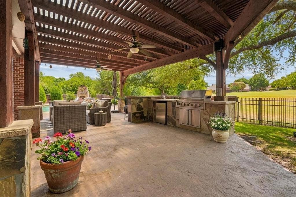 1712 Singletree Court, McKinney, TX 75072 Large pergola includes a built-in outdoor kitchen and grill with abundant entertaining space, and a great view!