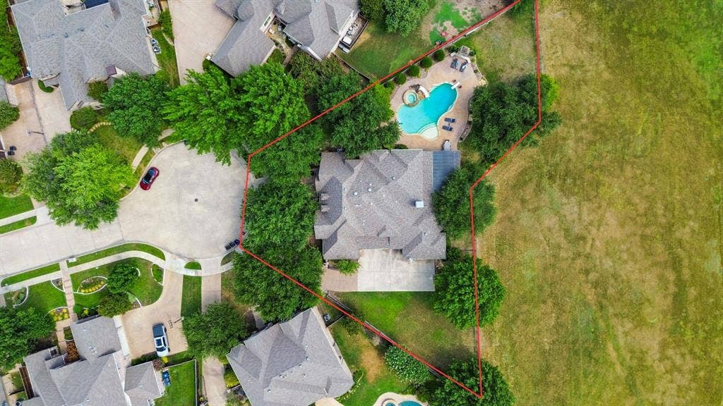 1712 Singletree Court, McKinney, TX 75072 Overhead view shows the home's substantial footprint and outdoor spaces across the 1/2 acre lot.