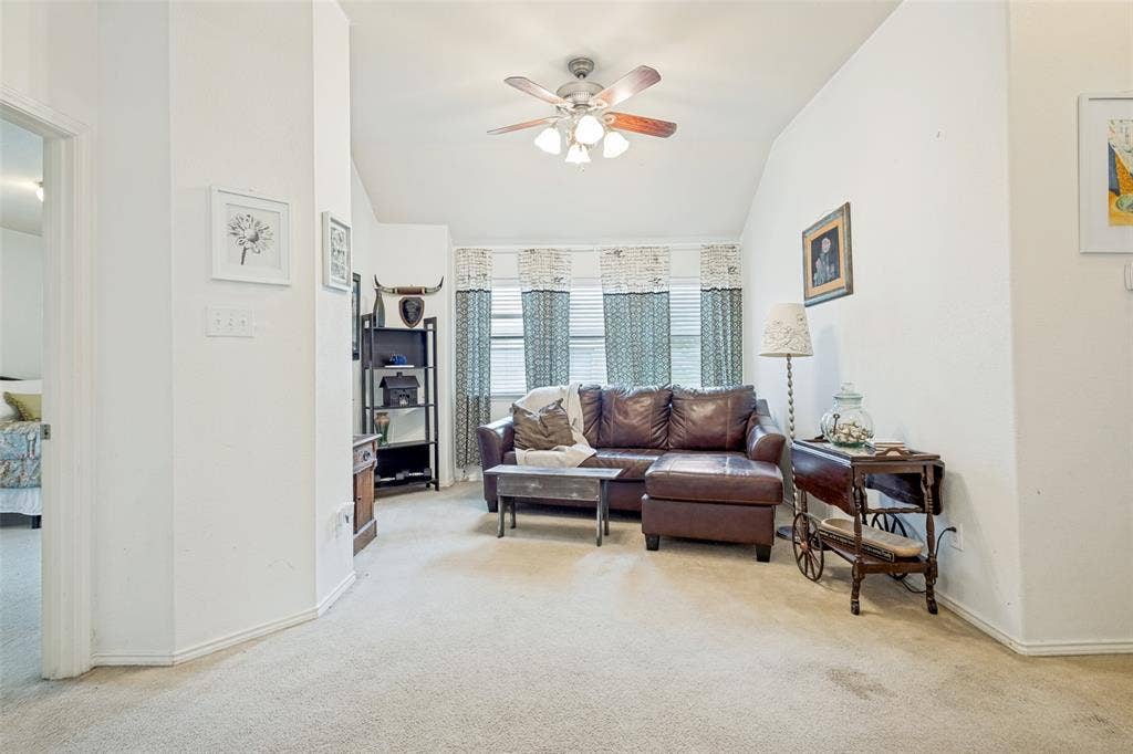 2118 Hanakoa Falls Drive, Anna, TX 75409 Separating the two bedrooms is a great secondary living room with vaulted ceilings. Makes a great office or play room.