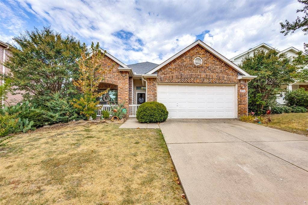 2118 Hanakoa Falls Drive, Anna, TX 75409 Brick exterior with arched entry. Wonderful size front porch.
