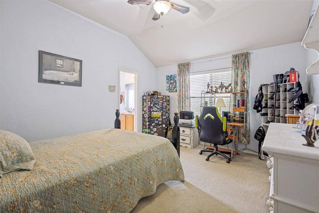 2118 Hanakoa Falls Drive, Anna, TX 75409 Vaulted ceiling featuring a ceiling fan with integrated lighting, carpet flooring, and a window with blinds