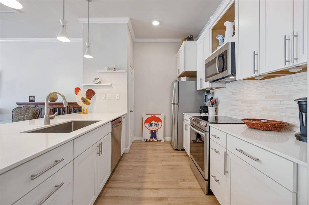 2305 Worthington Street, #104, Dallas, TX 75204 Replaced cabinets, pantry microwave & storage!