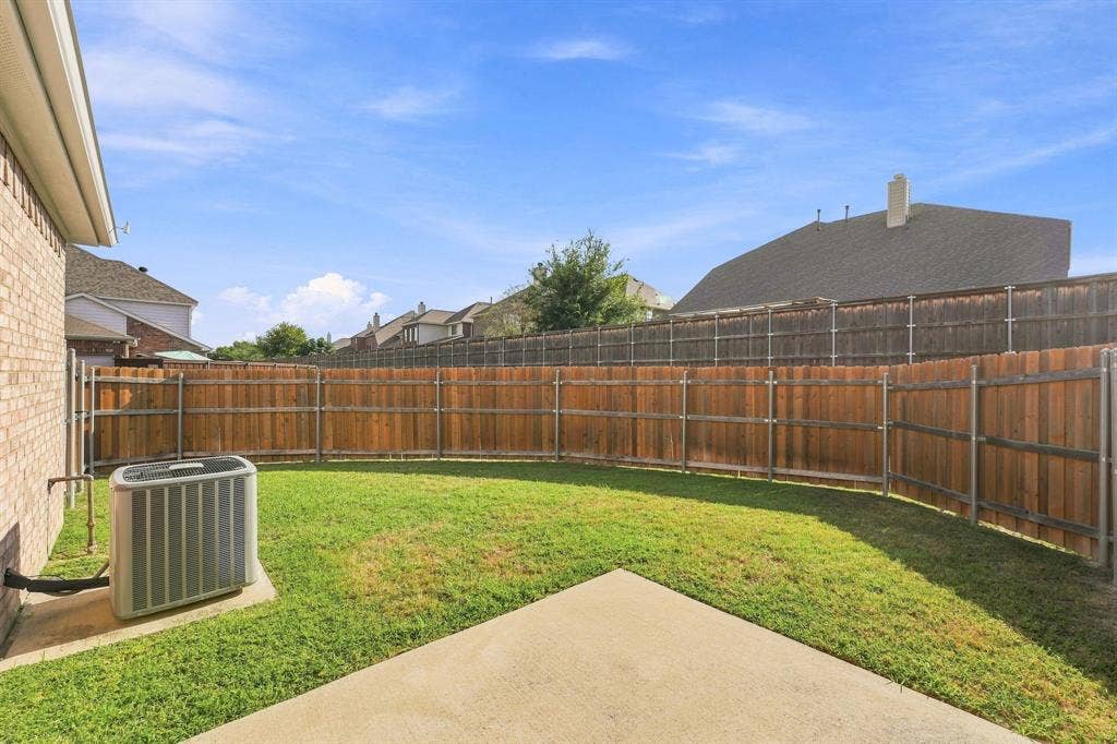 7449 Danbridge Lane, Frisco, TX 75035 Enjoy a private backyard with lawn maintenance included.