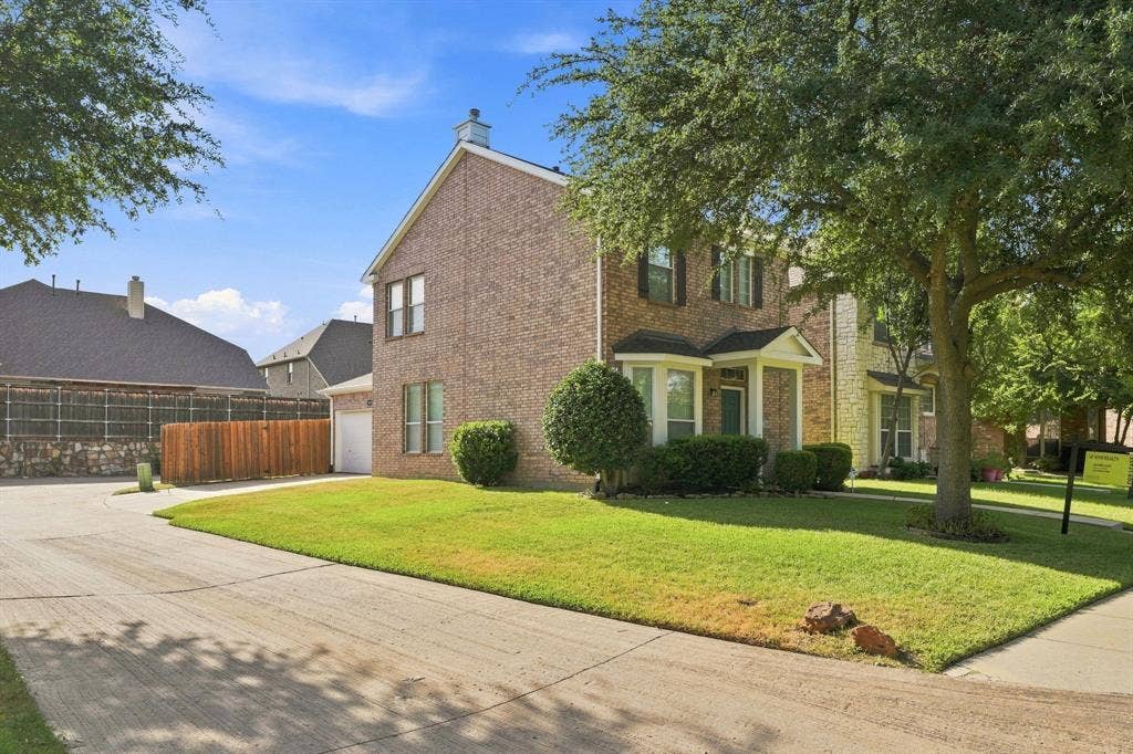 7449 Danbridge Lane, Frisco, TX 75035 Corner-lot setting with a private driveway and easy garage access.