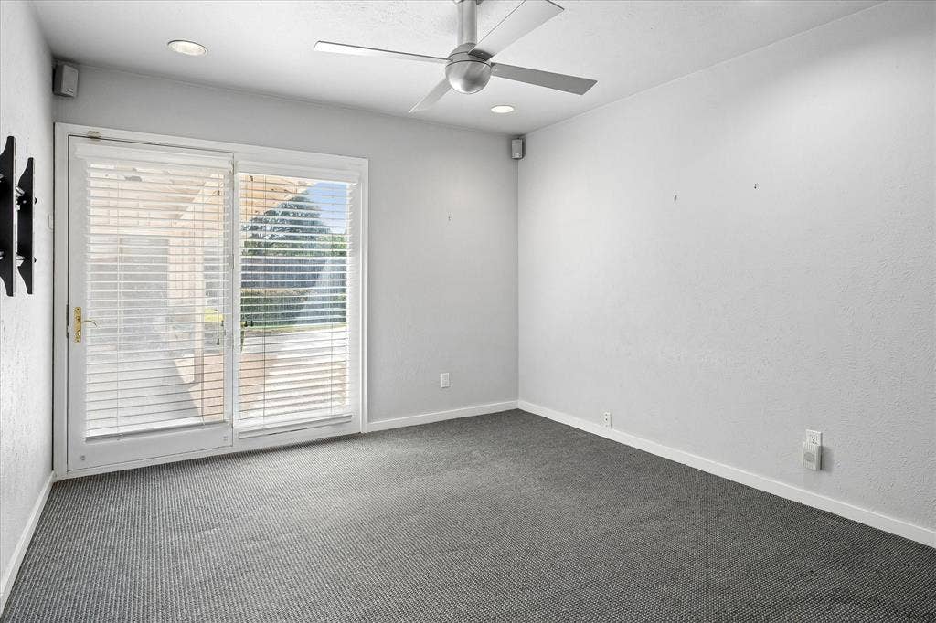 4108 Myerwood Lane, Dallas, TX 75244 Easily converted to a fourth bedroom with ceiling fan and French doors to the patio.