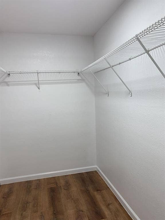 120 Plumthicket Lane, Trinidad, TX 75163 Wire shelving system with a corner configuration, white wall finish, and wood-finish flooring