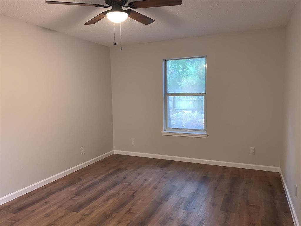 120 Plumthicket Lane, Trinidad, TX 75163 Wood-finish flooring, neutral wall tones, and a window with natural illumination