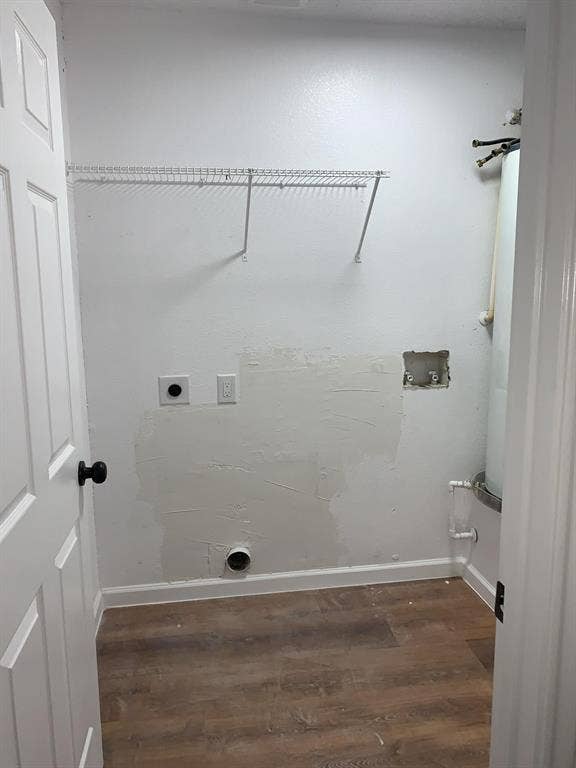120 Plumthicket Lane, Trinidad, TX 75163 Wood-finish flooring with white baseboards, wire shelving, and a panel door