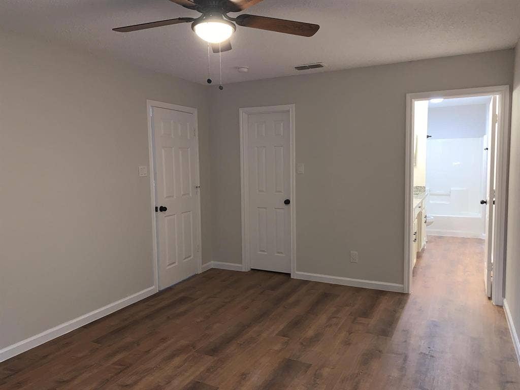 120 Plumthicket Lane, Trinidad, TX 75163 Wood-finish flooring, ceiling fan with integrated lighting, paneled doors, and light-toned walls