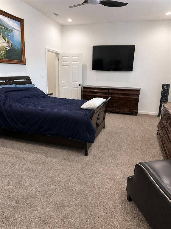 703 E Oates Road, Garland, TX 75043 Recessed ceiling lighting, ceiling fan, neutral wall paint, and light-colored carpeting