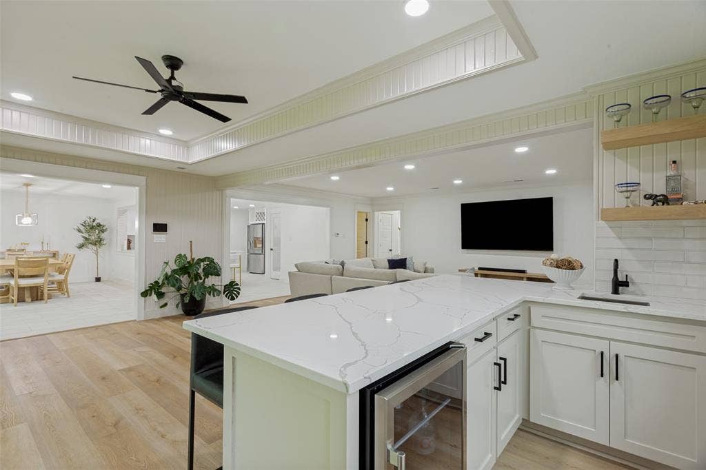 4316 Springbranch Drive, Benbrook, TX 76116 Light wood-finish flooring with recessed lighting and a built-in beverage refrigerator