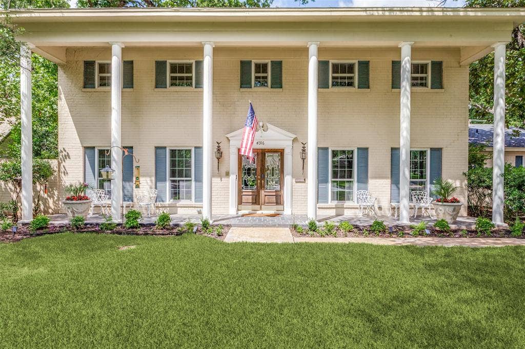 4316 Springbranch Drive, Benbrook, TX 76116 Two-story light brick exterior with a columned front porch, framed by mature trees