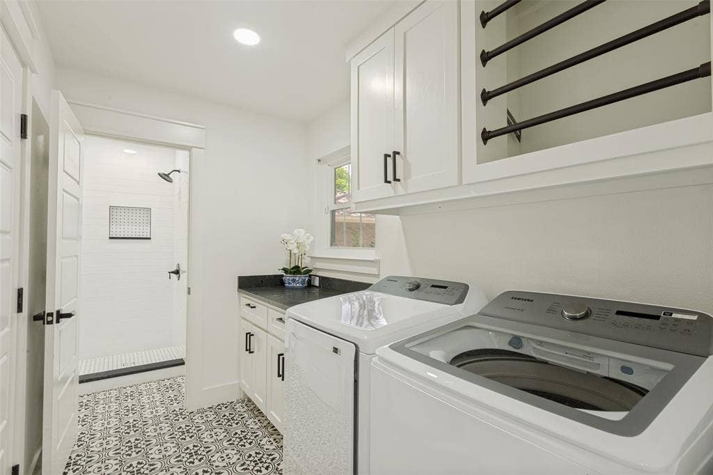 4316 Springbranch Drive, Benbrook, TX 76116 Laundry room with a patterned tile floor, white shaker-style cabinetry, dark countertop, and a built-in shower with white subway tile