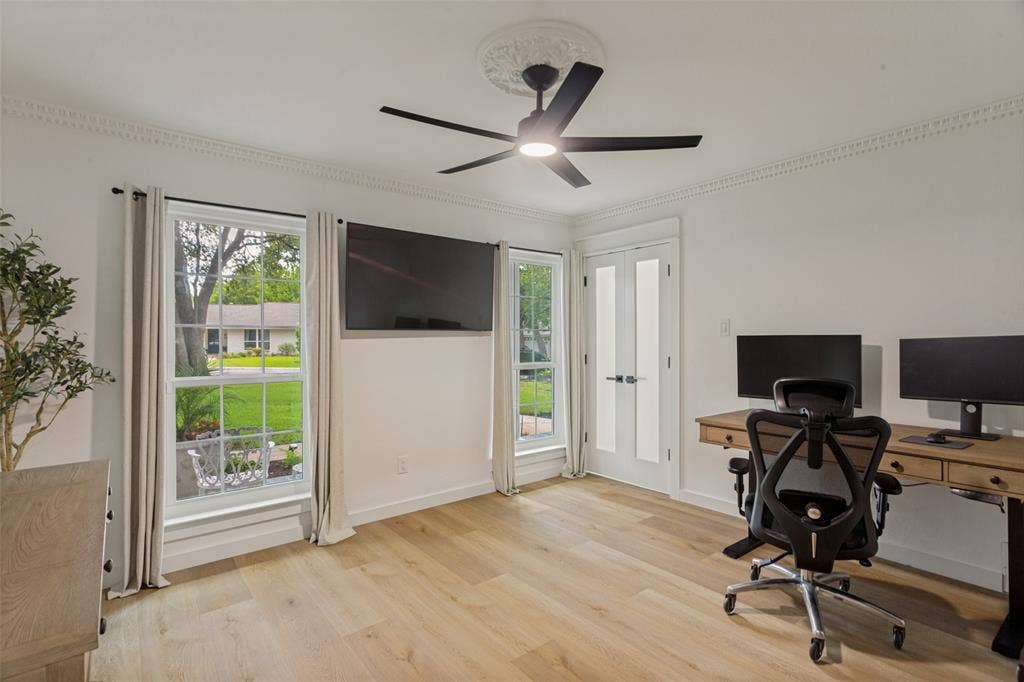 4316 Springbranch Drive, Benbrook, TX 76116 Light wood-finish flooring, white walls, and decorative crown molding