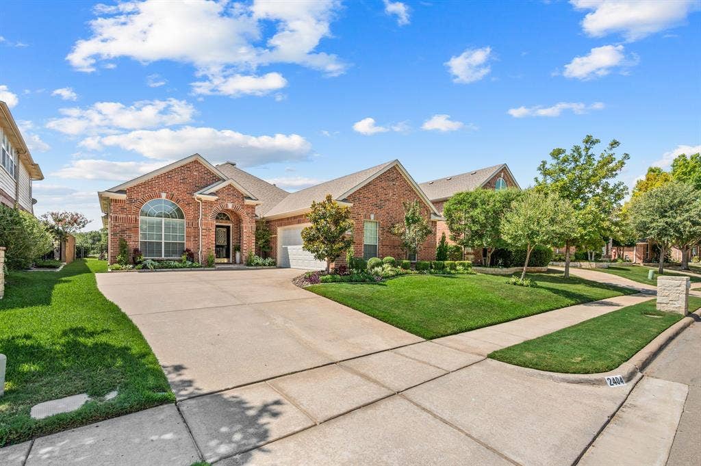 2404 Watercrest Drive, Keller, TX 76248 Beautiful curb appeal and lush landscaping.