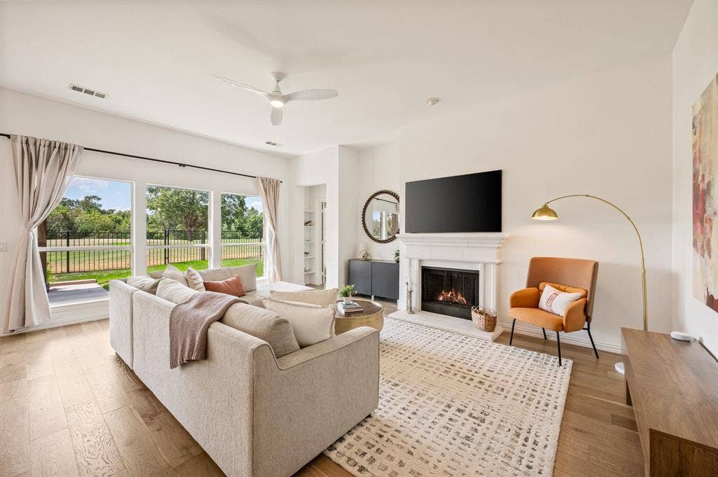 2404 Watercrest Drive, Keller, TX 76248 Gas fireplace that enhances the beauty of this spacious living room.