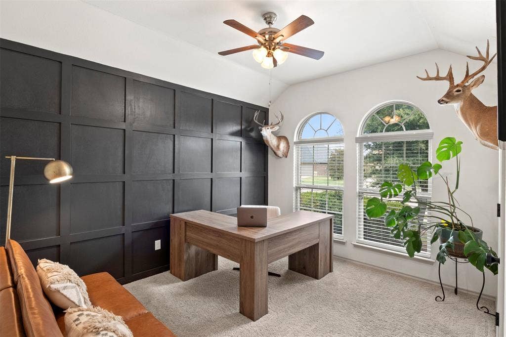 2189 Liriope Lane, Waxahachie, TX 75165 Currently styled as a home office, the third bedroom stands out with a bold accent wall, vaulted ceiling and abundant natural light.