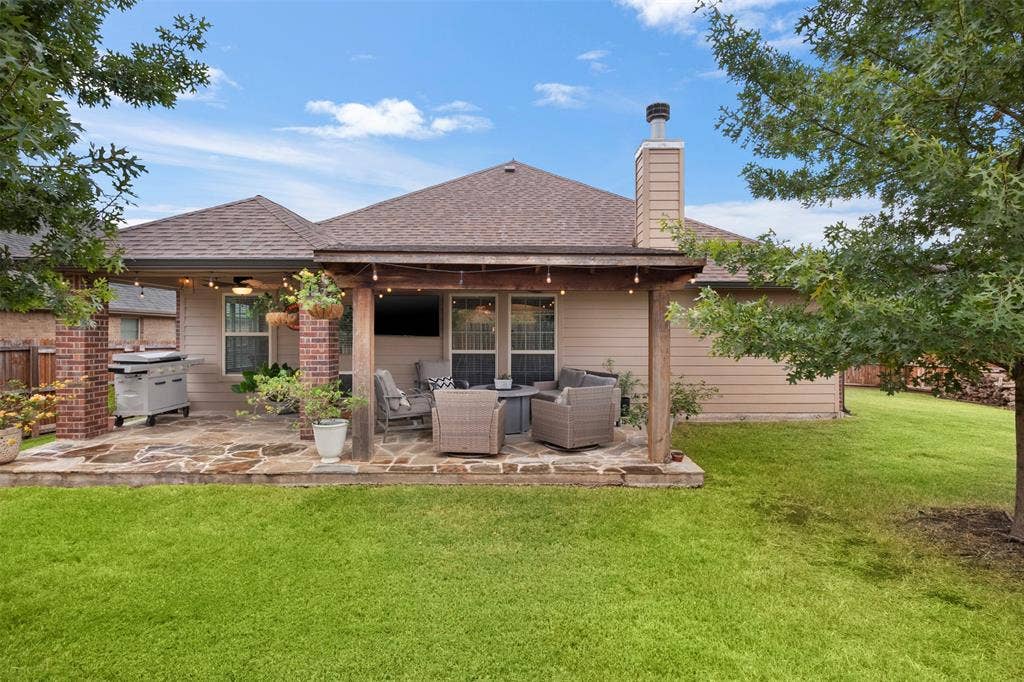 2189 Liriope Lane, Waxahachie, TX 75165 Large fenced backyard with mature trees and plenty of open lawn.