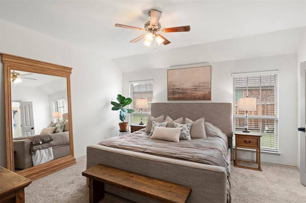 2189 Liriope Lane, Waxahachie, TX 75165 The spacious primary bedroom offers a calm, neutral retreat with fresh paint, abundant natural light and direct access to the ensuite bath.