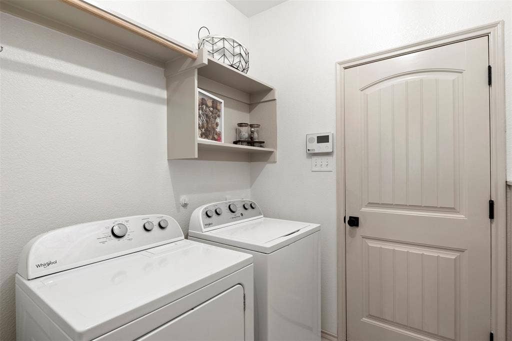 2189 Liriope Lane, Waxahachie, TX 75165 Dedicated laundry room with built-in storage and space for a full-size washer and dryer.