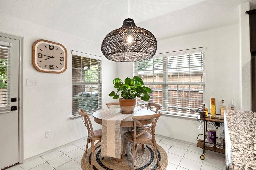 2189 Liriope Lane, Waxahachie, TX 75165 The breakfast area is surrounded by windows and sits just off the kitchen and easy access to the covered back porch.