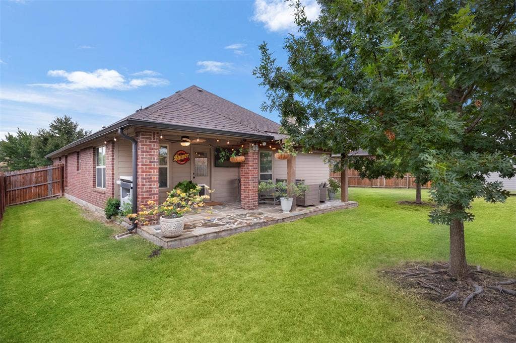 2189 Liriope Lane, Waxahachie, TX 75165 The extended covered patio opens directly to the backyard, giving buyers plenty of room to relax, entertain and enjoy the outdoors.