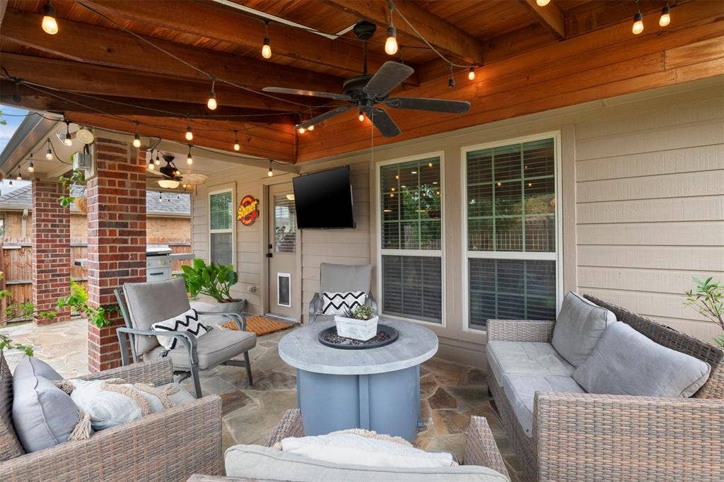 2189 Liriope Lane, Waxahachie, TX 75165 Flagstone flooring, overhead fan and string lighting make this covered space ready for outdoor dining and entertaining.