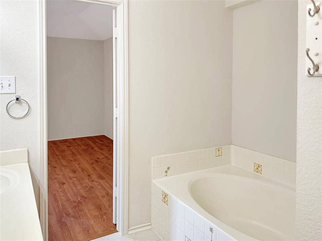 3457 Newgate Street, Midlothian, TX 76065 Bathroom featuring a bath, wood finished floors, and vanity