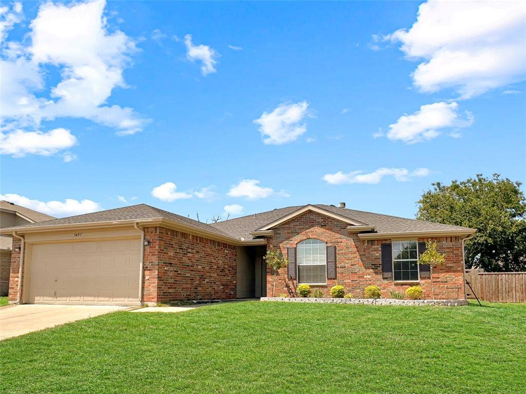 3457 Newgate Street, Midlothian, TX 76065 Ranch-style home featuring roof with shingles, a garage, concrete driveway, and brick siding